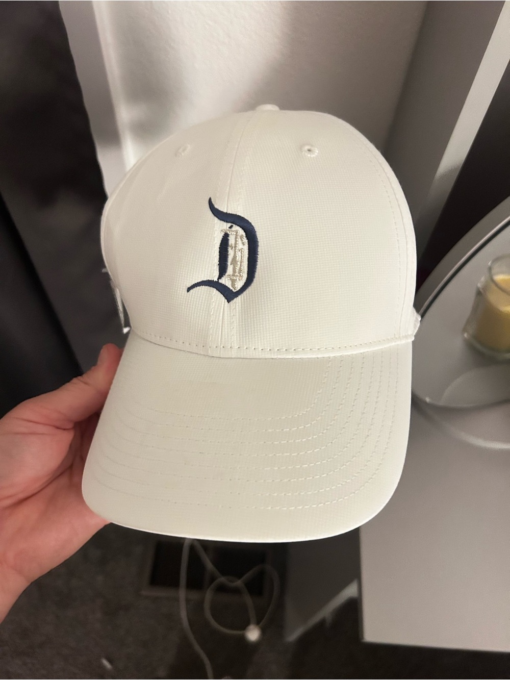 Nike Disney White Baseball Cap with Navy 'D' Logo